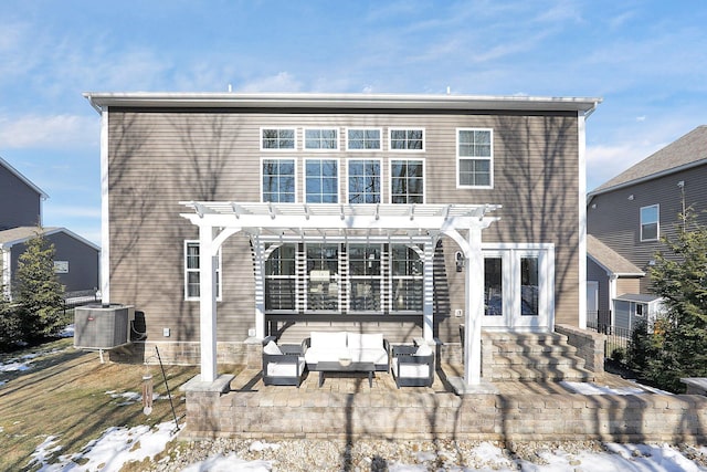 back of property featuring an outdoor living space, central air condition unit, a patio, and a pergola