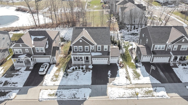 snowy aerial view with a residential view