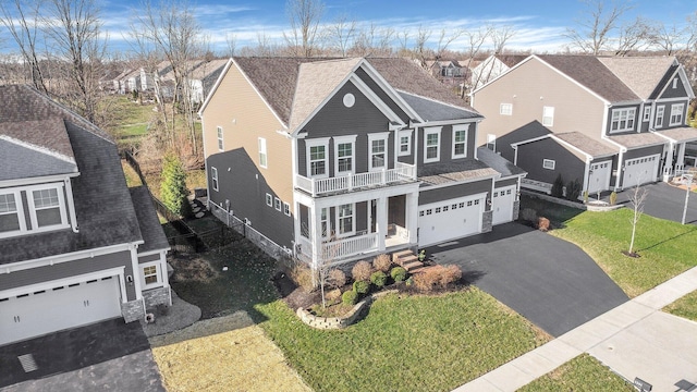 1241 Mcclish Ct, Grove City, OH 43123 - view of front of home featuring asphalt driveway, a garage, a residential view, covered porch, and a front lawn