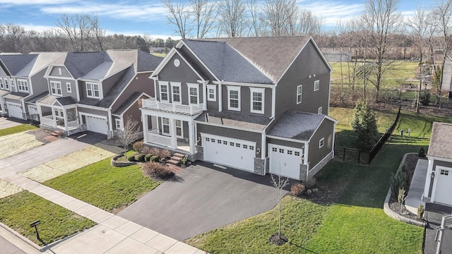 1241 Mcclish Ct, Grove City, OH 43123 - view of front of house featuring asphalt driveway, a garage, stone siding, and a front yard