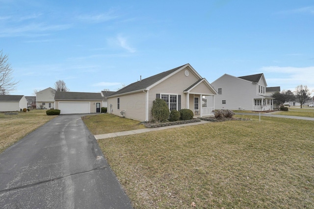 view of front facade featuring a garage and a front yard