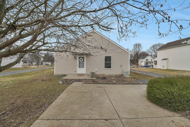 bungalow-style home with a front lawn