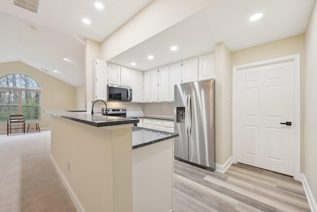 kitchen featuring stainless steel appliances, recessed lighting, visible vents, and white cabinetry