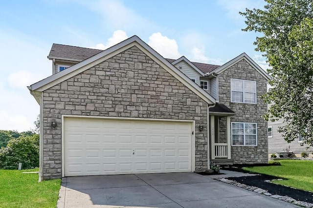 view of front of home featuring a front lawn, an attached garage, and driveway