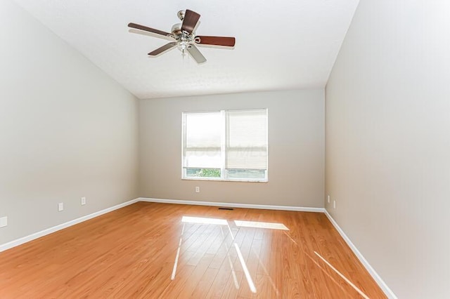 empty room with baseboards, light wood-style flooring, and a ceiling fan