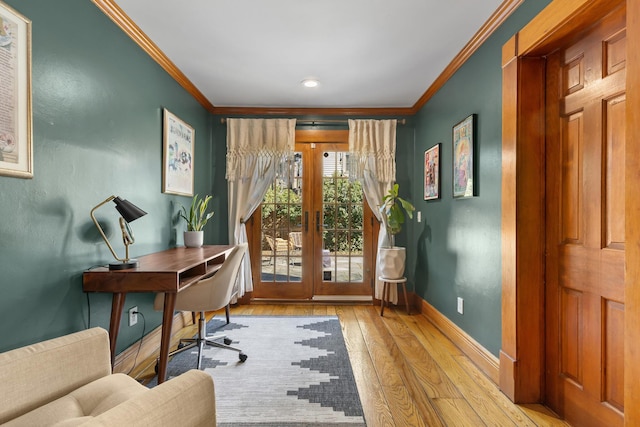 office area featuring french doors, baseboards, ornamental molding, and hardwood / wood-style flooring