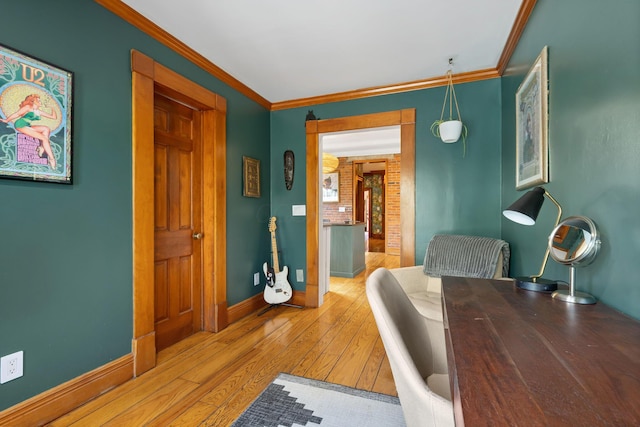 office featuring crown molding, baseboards, and wood-type flooring