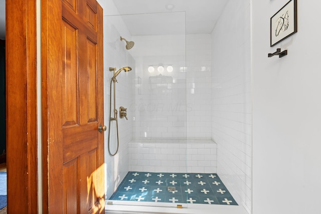 full bathroom with tiled shower