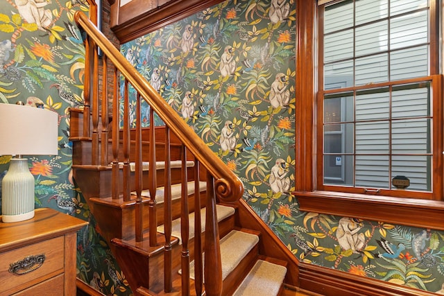 stairway with wallpapered walls