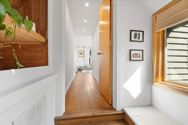 hallway with hardwood / wood-style flooring and recessed lighting