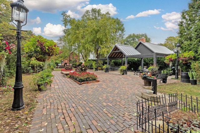 view of home's community with a gazebo and fence