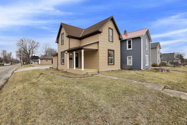 view of home's exterior featuring a lawn and a chimney