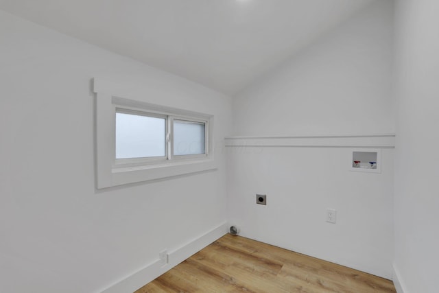 clothes washing area featuring baseboards, laundry area, light wood-style flooring, hookup for a washing machine, and electric dryer hookup