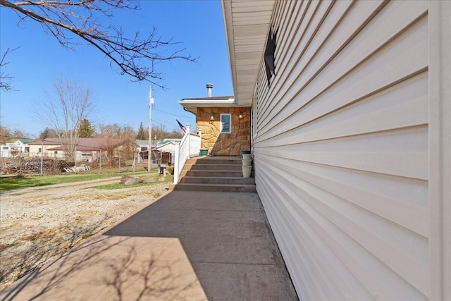 exterior space featuring stone siding