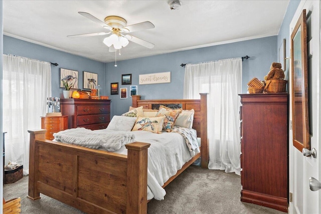 bedroom featuring carpet flooring, ceiling fan, and ornamental molding