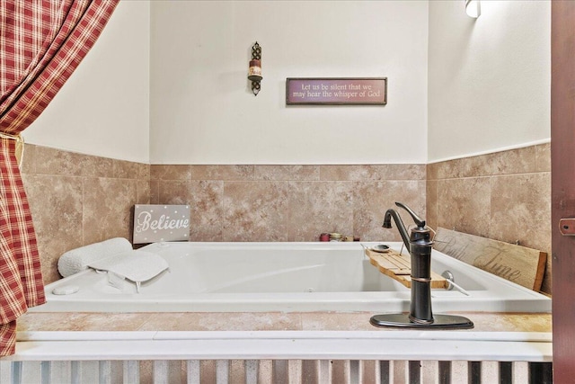 full bath featuring a tub with jets