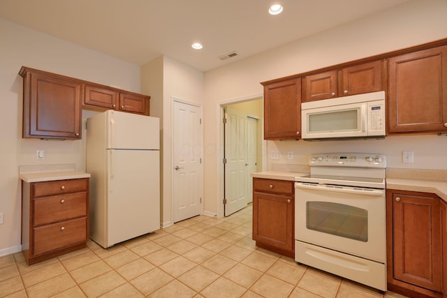 kitchen with white appliances, visible vents, recessed lighting, light countertops, and brown cabinets