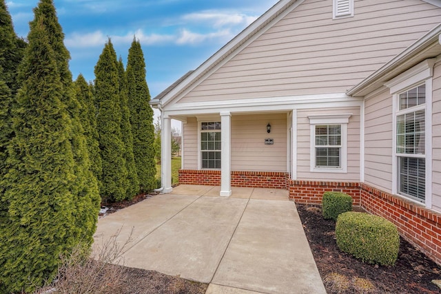 property entrance with brick siding