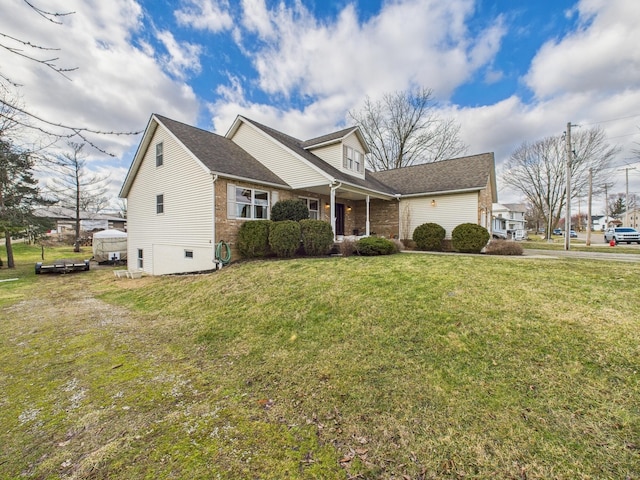 cape cod home featuring crawl space, brick siding, and a front yard