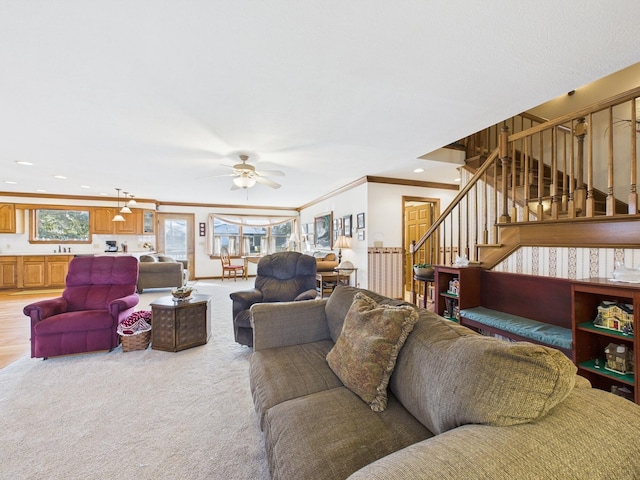 living room featuring crown molding, stairway, light carpet, recessed lighting, and a ceiling fan