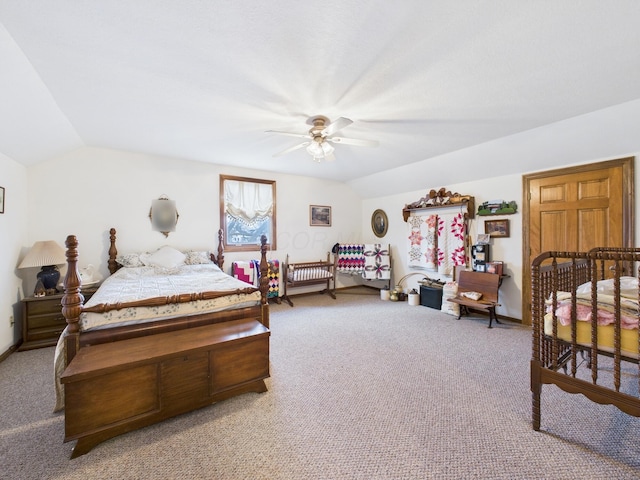 bedroom with baseboards, carpet, ceiling fan, and vaulted ceiling