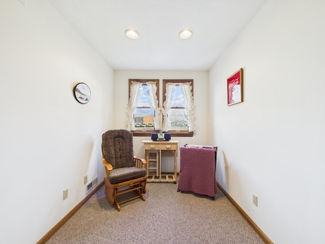 living area featuring recessed lighting, visible vents, baseboards, and carpet floors