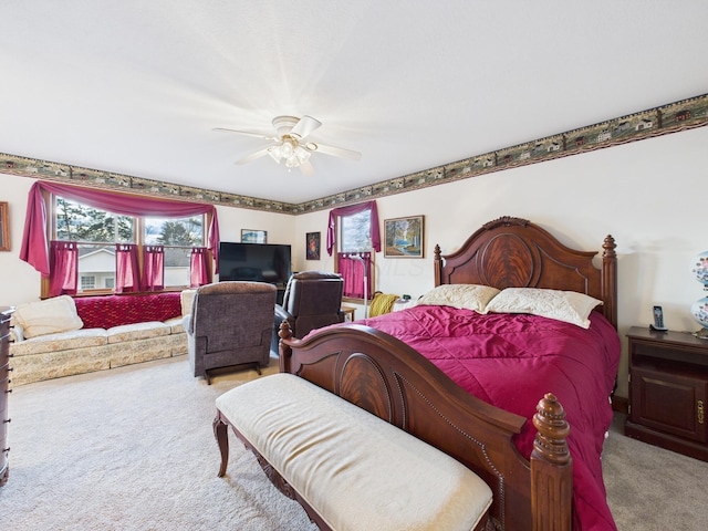 carpeted bedroom with a ceiling fan