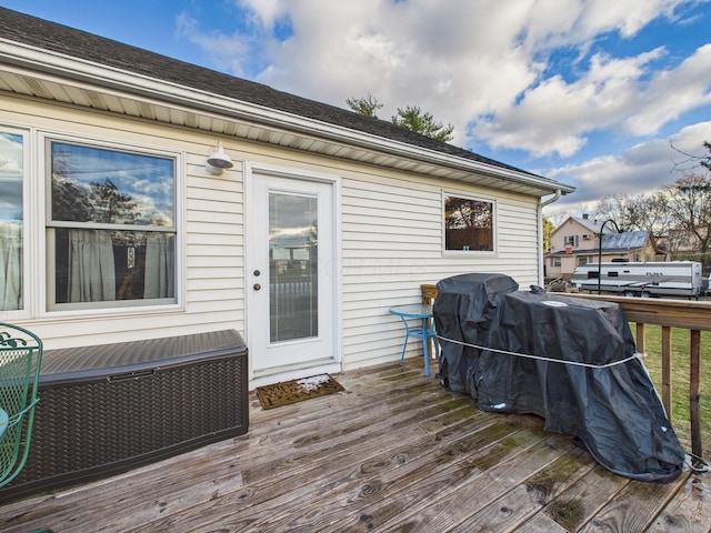 wooden terrace featuring grilling area