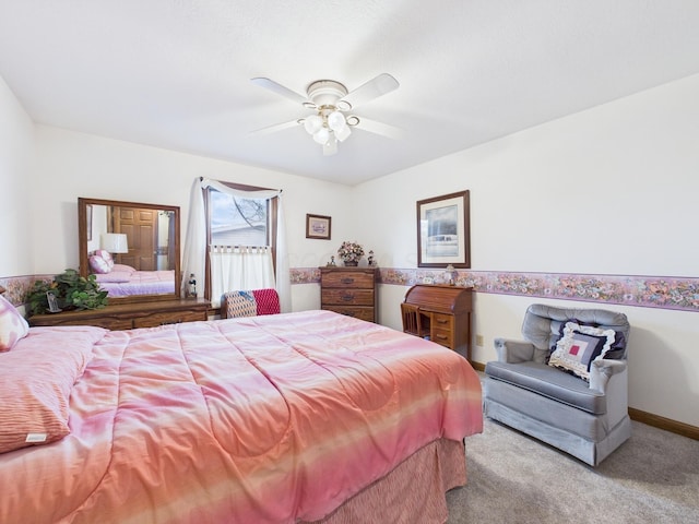 bedroom featuring baseboards, a ceiling fan, and carpet