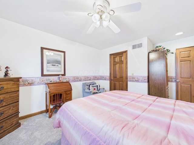 bedroom with baseboards, carpet flooring, a ceiling fan, and visible vents