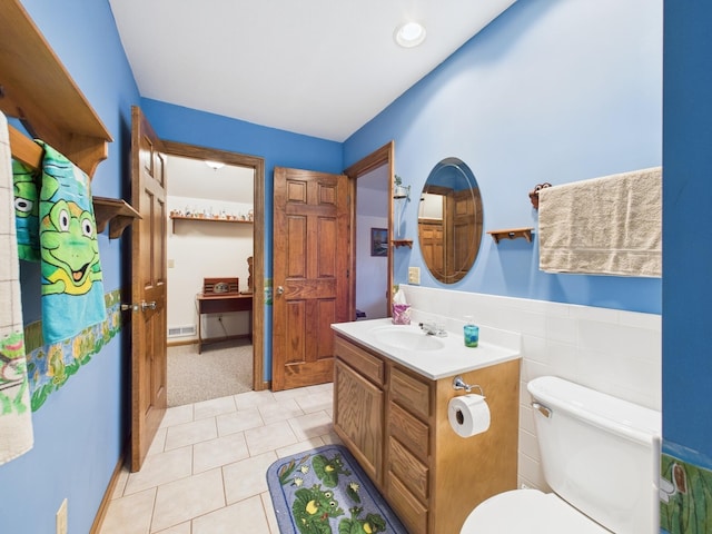 bathroom featuring tile patterned floors, visible vents, toilet, and vanity