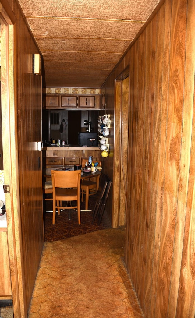 kitchen featuring wood walls