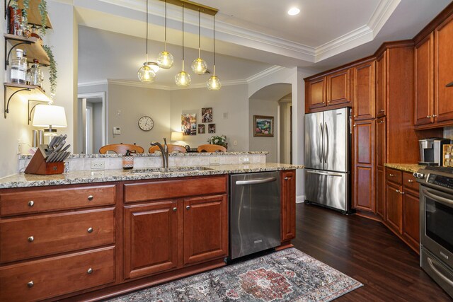 kitchen with a sink, dark wood finished floors, arched walkways, appliances with stainless steel finishes, and light stone countertops