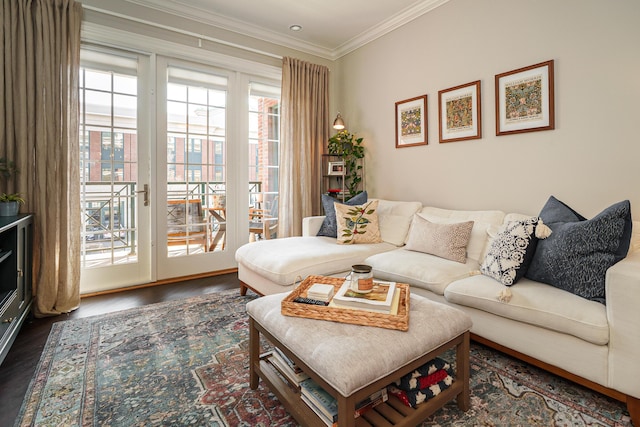 living room with dark wood finished floors and crown molding