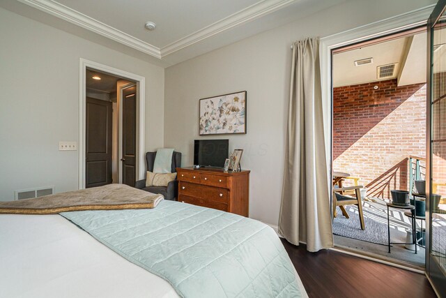 bedroom with visible vents, dark wood-style flooring, and ornamental molding