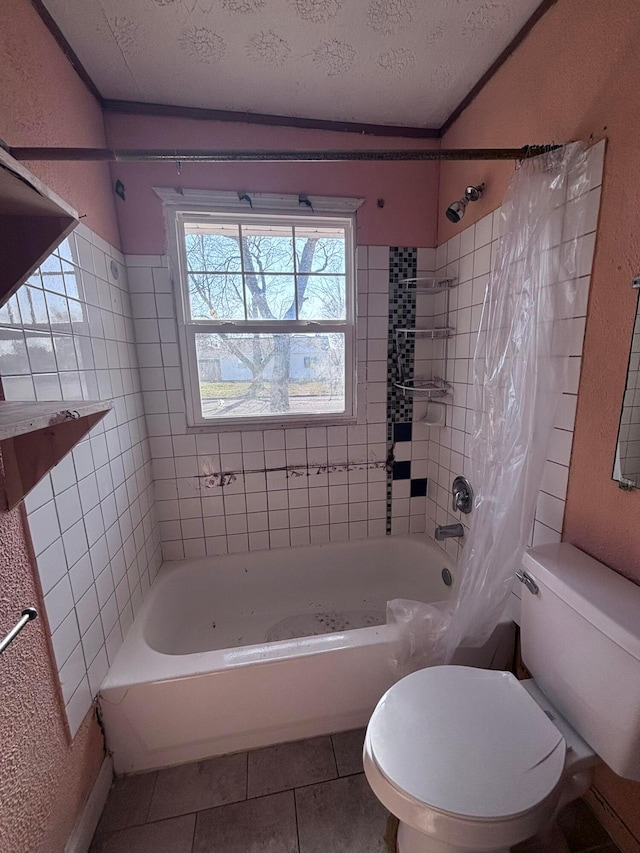 bathroom with shower / bath combo with shower curtain, toilet, a textured ceiling, tile patterned flooring, and a textured wall