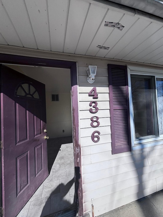 property entrance featuring visible vents