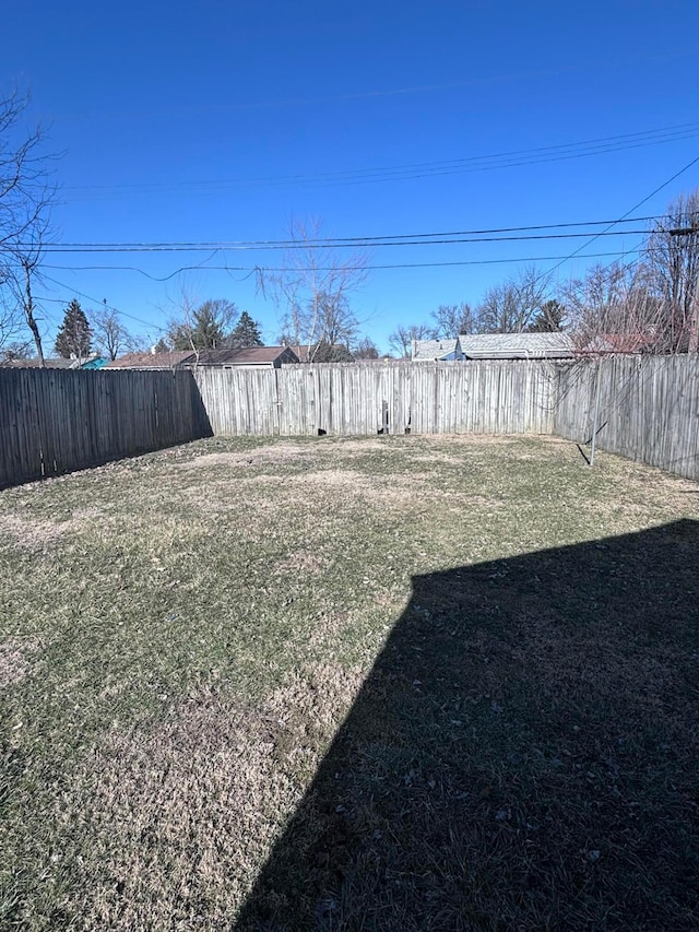 view of yard featuring a fenced backyard