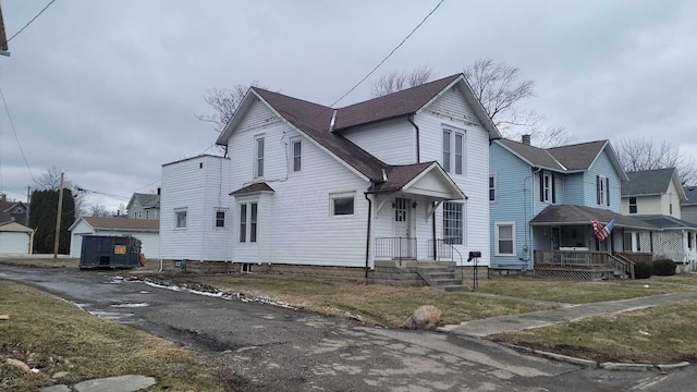 view of front of home with roof with shingles