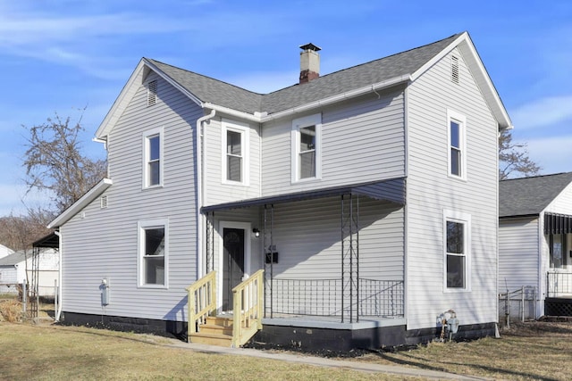 view of front of property featuring covered porch, a chimney, a front yard, and roof with shingles