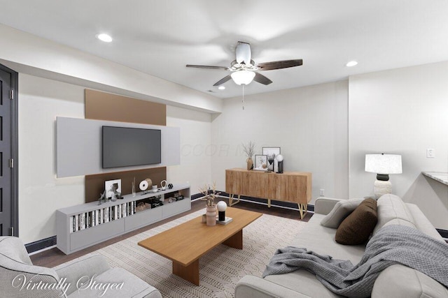 living area featuring a ceiling fan, recessed lighting, wood finished floors, and baseboards