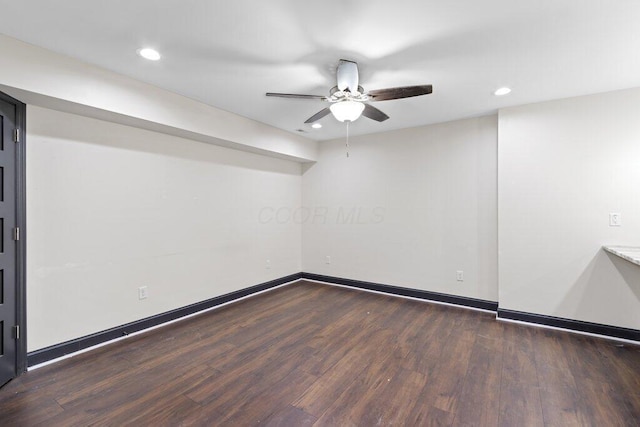 unfurnished room featuring recessed lighting, baseboards, dark wood-type flooring, and a ceiling fan