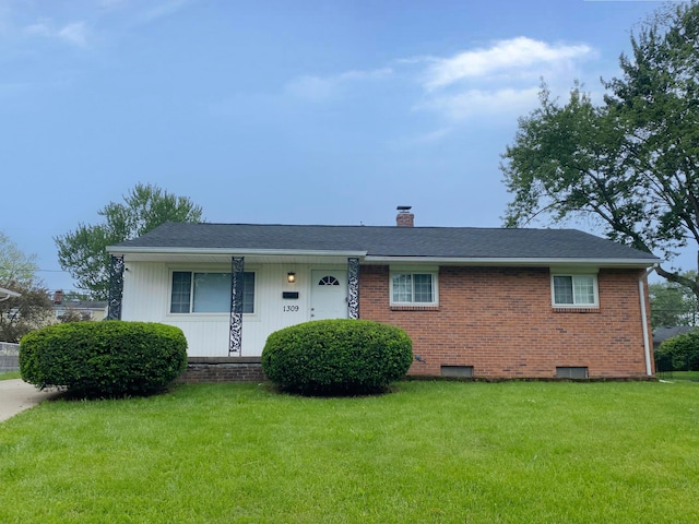 1309 Shanley Dr, Columbus, OH 43224 - ranch-style home featuring a chimney, a front yard, brick siding, and roof with shingles