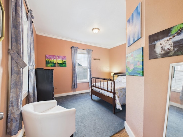 bedroom featuring carpet flooring, baseboards, and ornamental molding