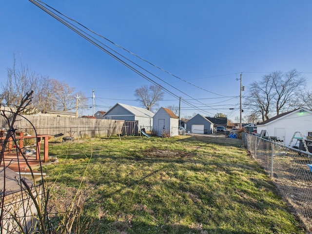 view of yard featuring a fenced backyard and a playground