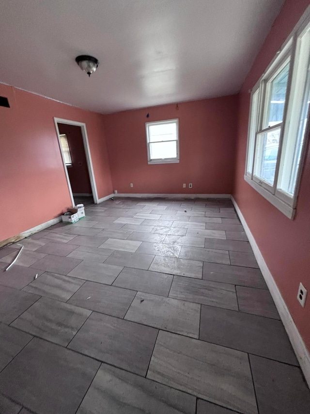 empty room featuring baseboards