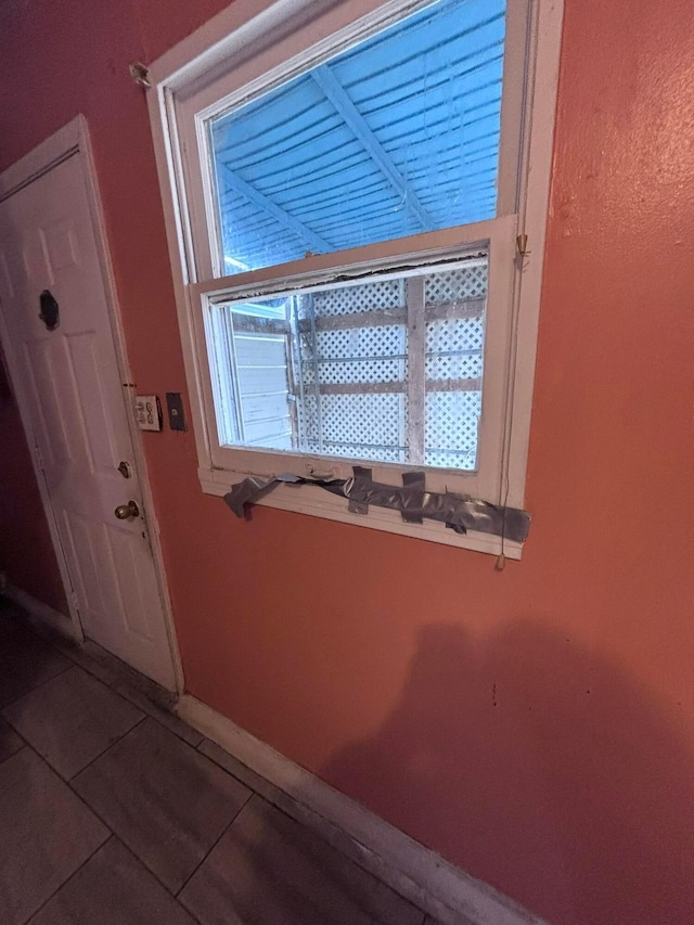 interior space with tile patterned floors