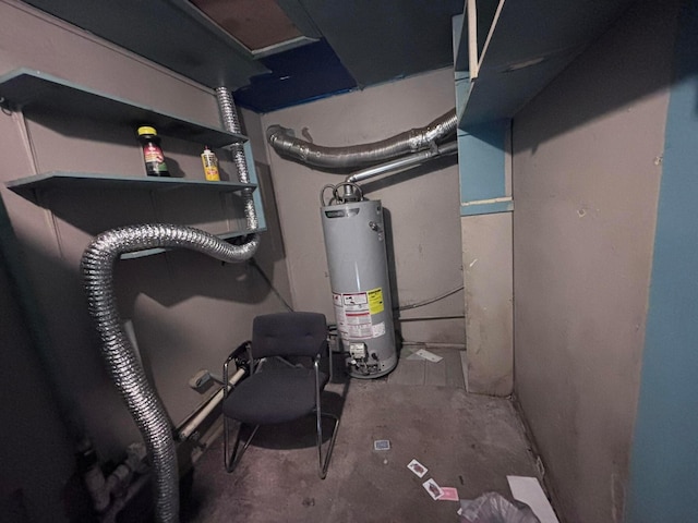 utility room featuring water heater