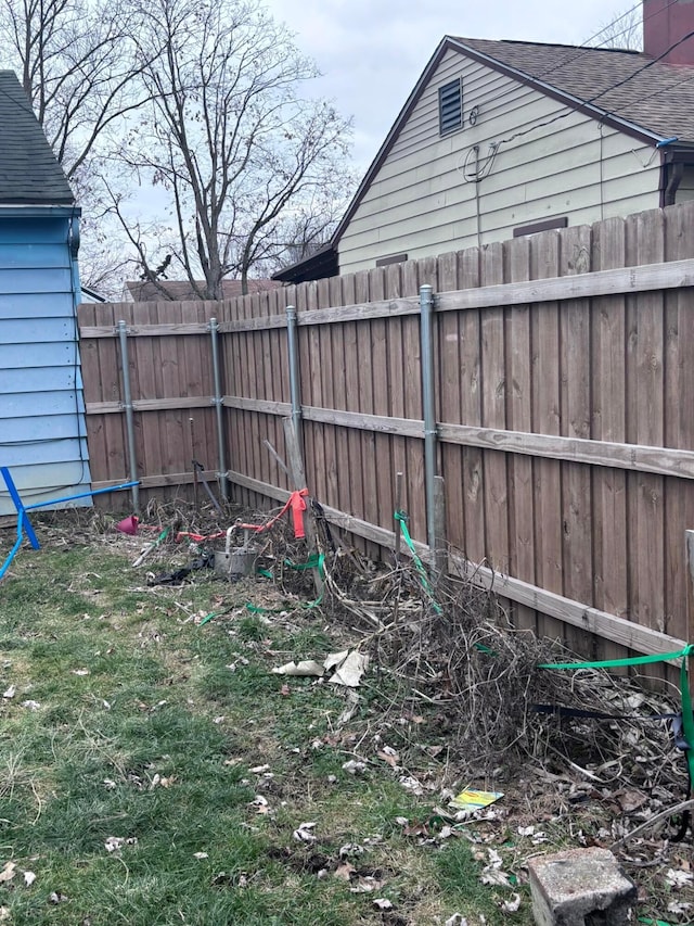 view of yard with a fenced backyard