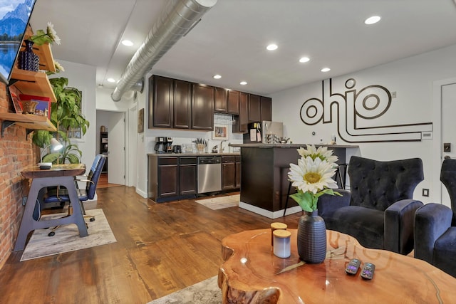 living room with recessed lighting and dark wood-style flooring